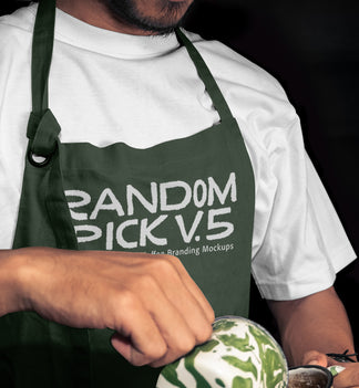 Close-up of a barista in a dark green apron mockup holding a latte art cup mockup with matcha green swirl, dark moody background, perfect for coffee brand identity mockup