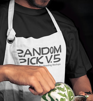 Close-up of a barista in a white apron mockup holding a latte art cup mockup with matcha green swirl, dark moody background, perfect for coffee brand identity mockup