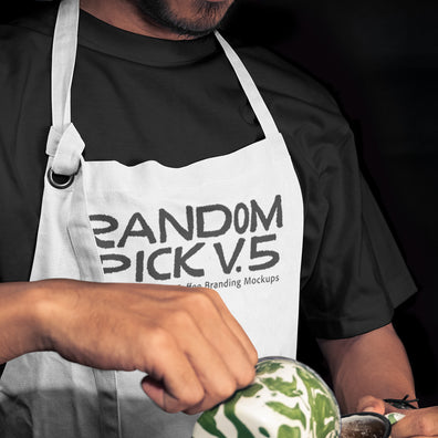 Close-up of a barista in a white apron mockup holding a latte art cup mockup with matcha green swirl, dark moody background, perfect for coffee brand identity mockup