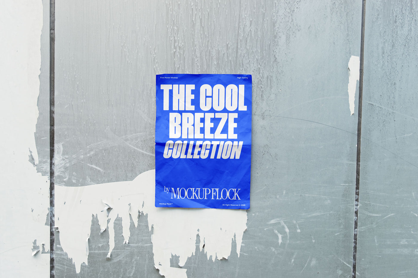 A vertical blue poster mockup on a wall peeling off its paint in natural lighting, revealing a blank white surface with a paper texture. Design by Mockup Flock
