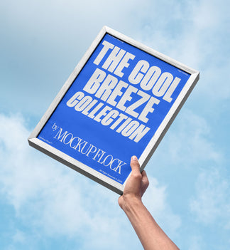 A person holds a poster that says "THE COOL BREEZE COLLECTION BY MOCKUP FLOCK" in bold text, on a blue sky background.