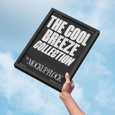 A person holds a poster that says "THE COOL BREEZE COLLECTION BY MOCKUP FLOCK" in bold text, on a blue sky background.