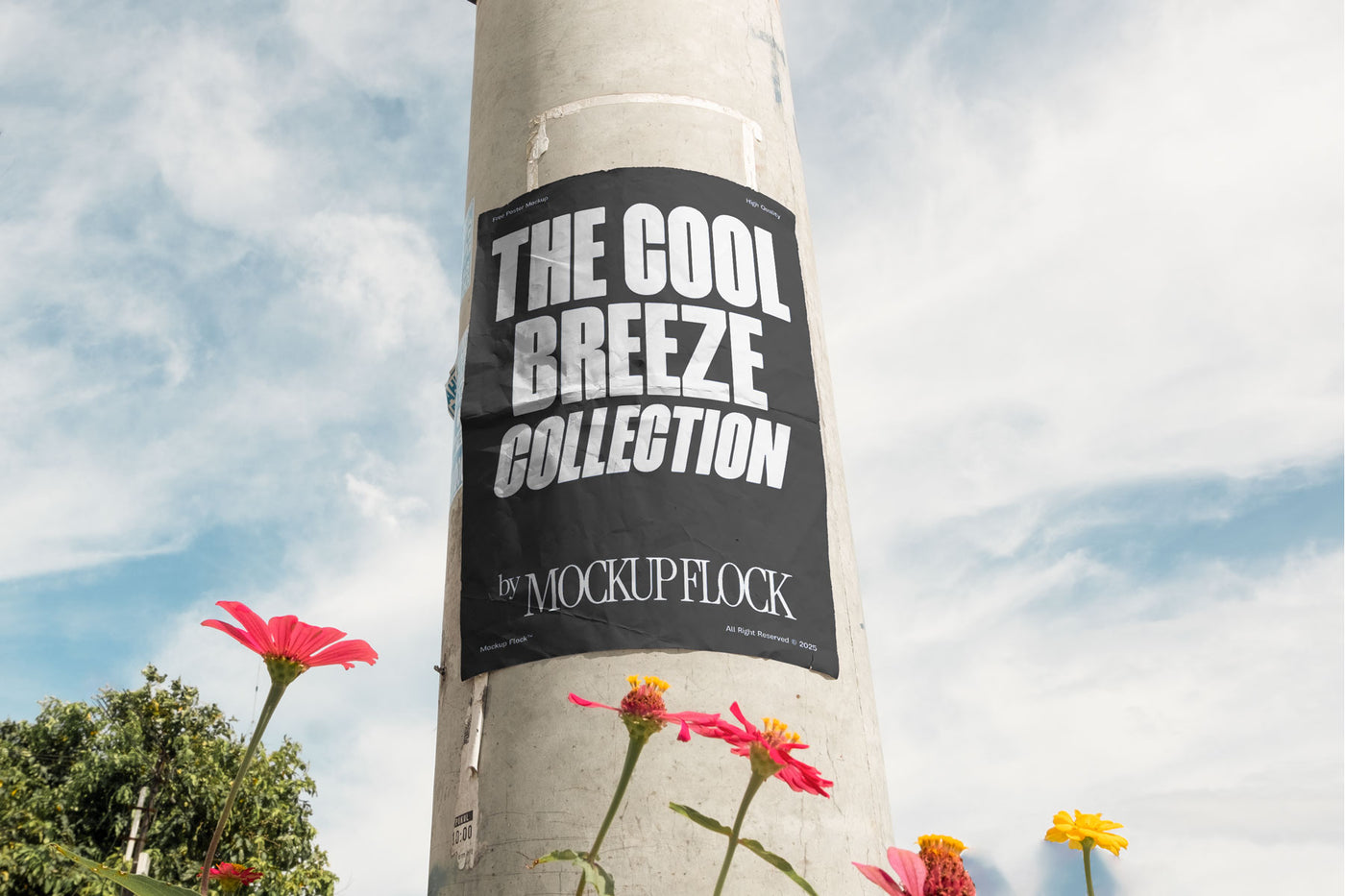 Vertical poster mounted on a pole with natural lighting, surrounded by red and yellow flowers against a blue sky.