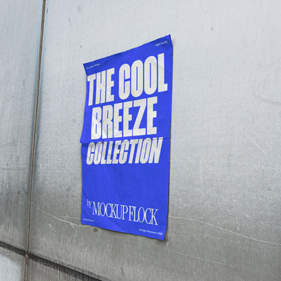 Mockup of a blue vertical poster attached to a wall with a paper texture inside. Design by Mockup Flock