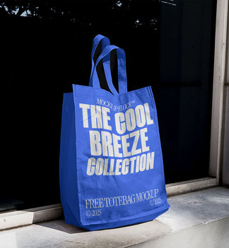 A blue poster with white text reading THE COOL BREEZE COLLECTION BY MOCKUP FLOCK, is stuck to the window.