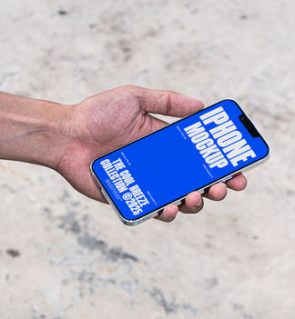 A person is holding an iPhone that says "IPHONE MOCKUP THE COOL BREEZE COLLECTION @2025" in bold white text. Design by Mockup Flock