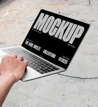 A person is holding an Macbook Device that says "MOCKUP THE COOL BREEZE COLLECTION @2025" in bold white text. Design by Mockup Flock