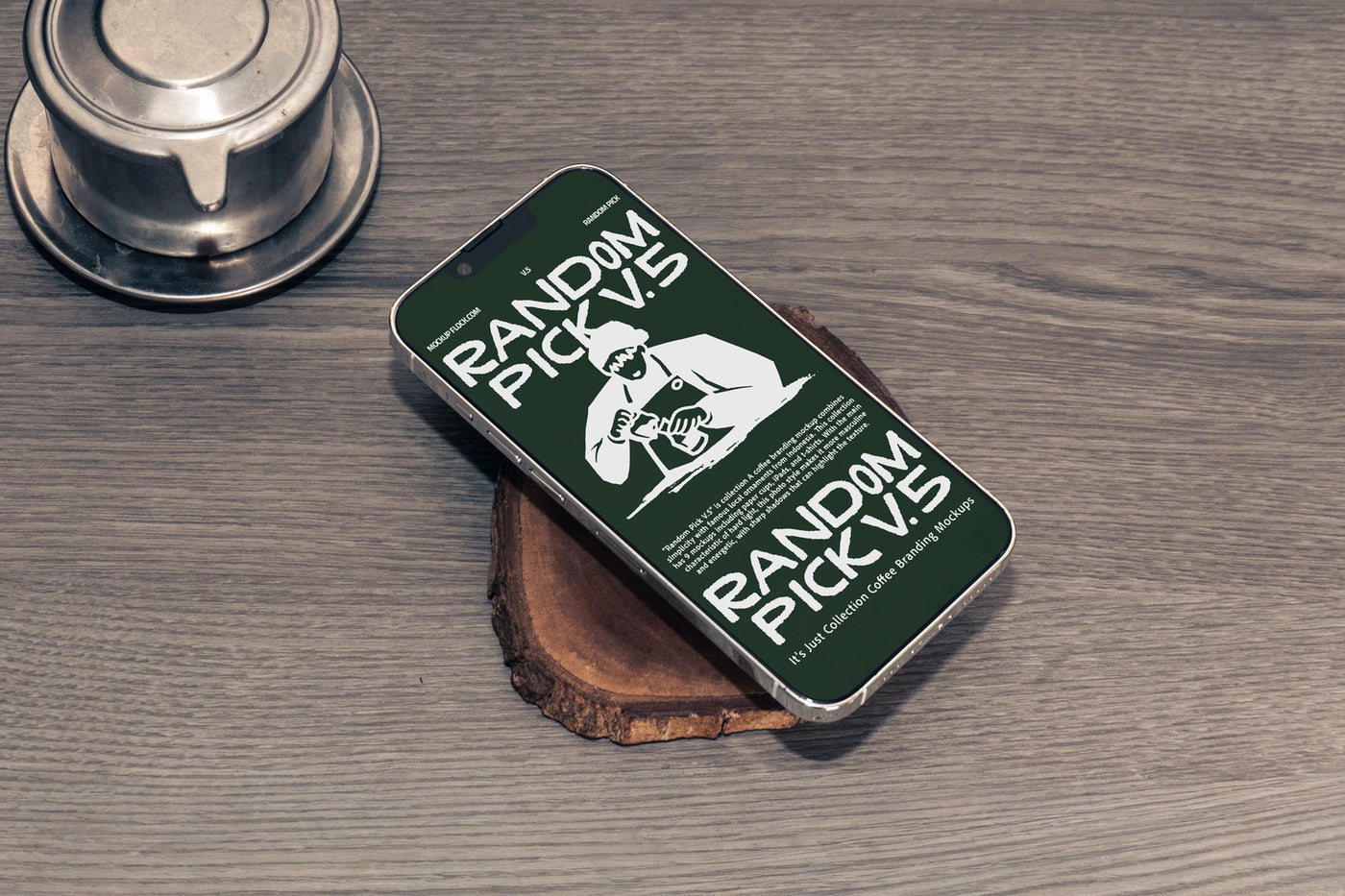Green iPhone lying flat at an angle on a wood slice next to a Vietnamese coffee drip filter on a rustic wooden table, dark moody flat lay phone mockup for cafe branding