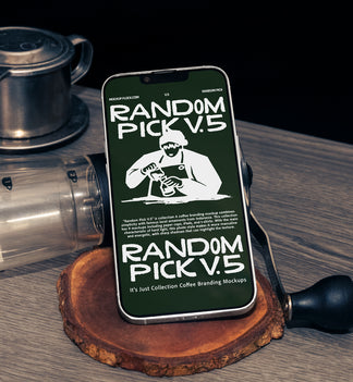 Green iPhone standing upright on a wood slice coaster surrounded by coffee props including a manual grinder and Vietnamese drip filter on a wooden table with dark background