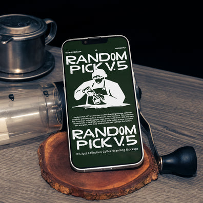 Green iPhone standing upright on a wood slice coaster surrounded by coffee props including a manual grinder and Vietnamese drip filter on a wooden table with dark background