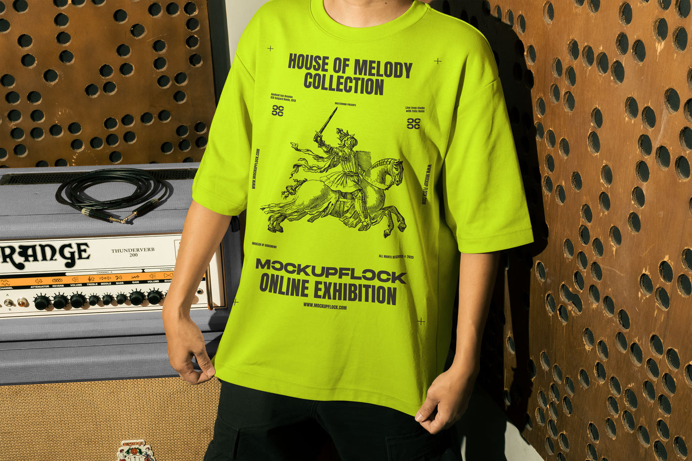 This high quality t-shirt mockup features a person standing in front of an amplifier in a music studio. This aesthetic print mockup was created in Adobe Photoshop.