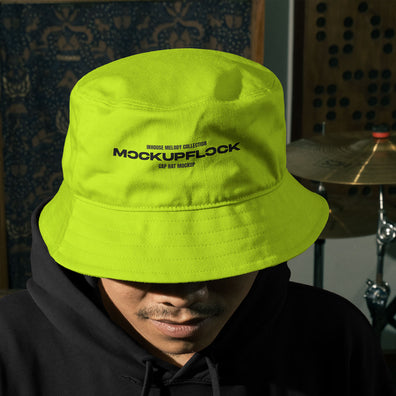 High quality bucket hat mockup of someone wearing a bucket and hoodie in a music studio. Aesthetic print mockup created for Adobe Photoshop