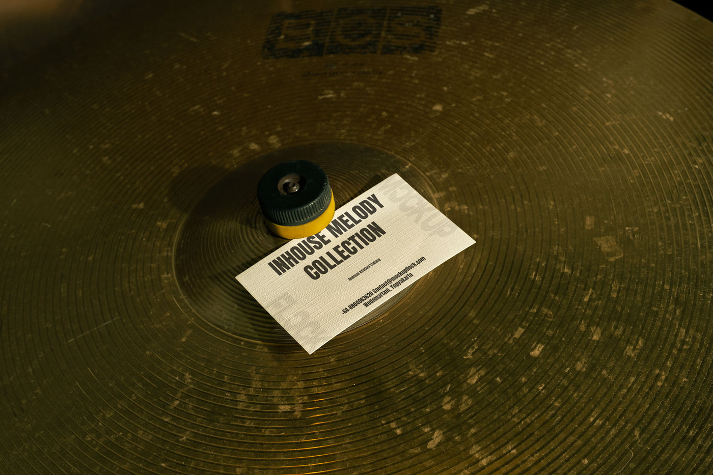 High quality business card mockup leaning on a cymbal drums. Aesthetic print mockup created for Adobe Photoshop