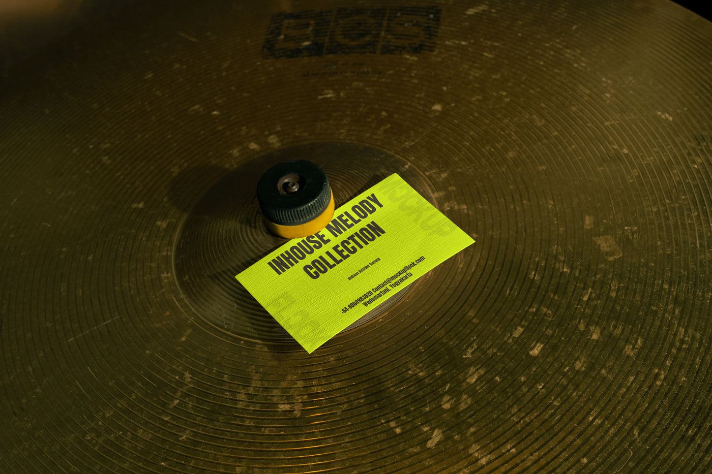 High quality business card mockup leaning on a cymbal drums. Aesthetic print mockup created for Adobe Photoshop
