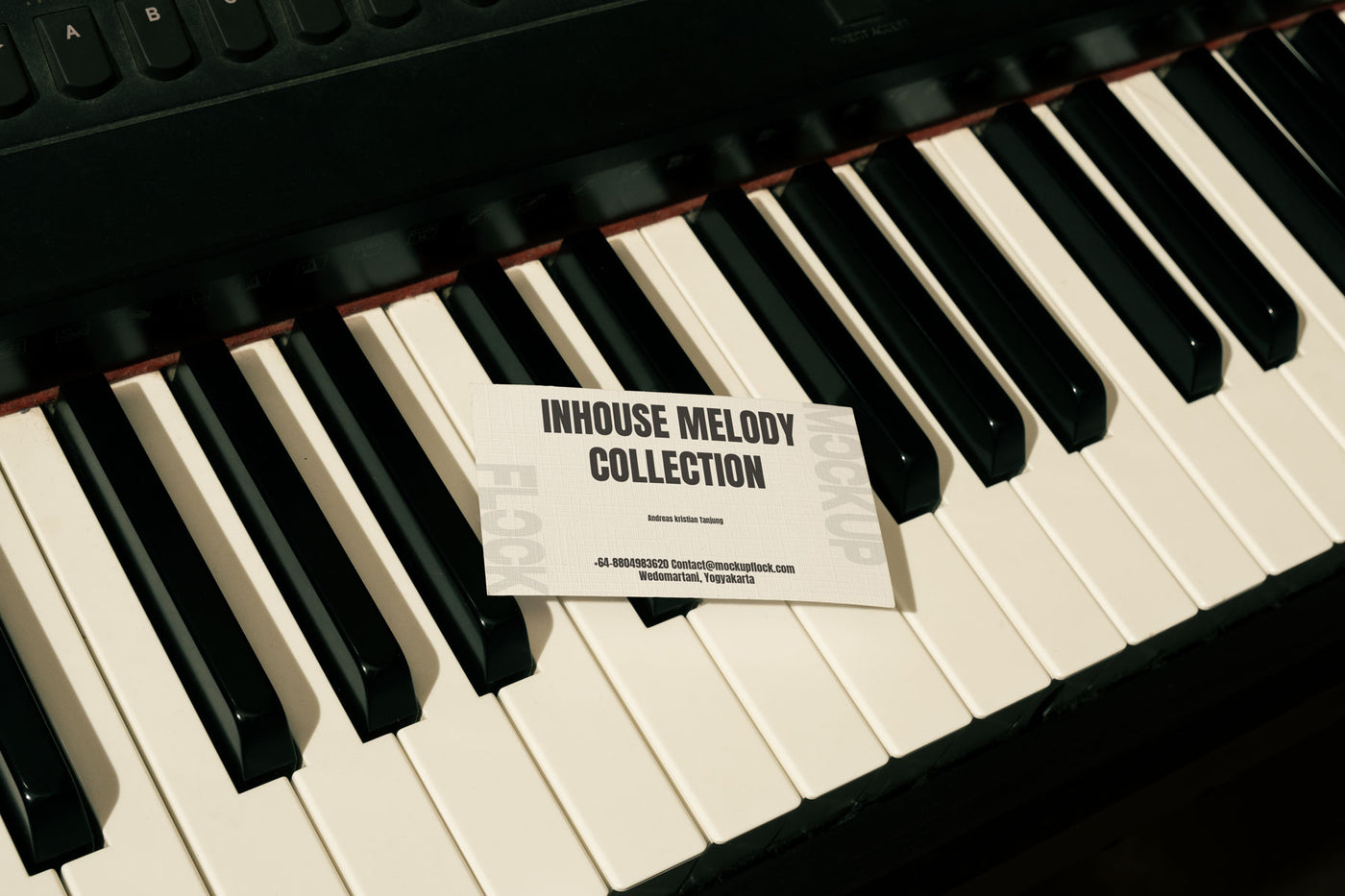 High quality business card mockup leaning on a piano. Aesthetic print mockup created for Adobe Photoshop