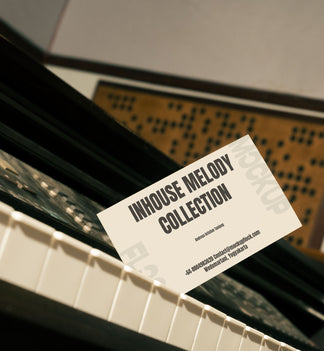 High quality business card mockup leaning on a piano. Aesthetic print mockup created for Adobe Photoshop
