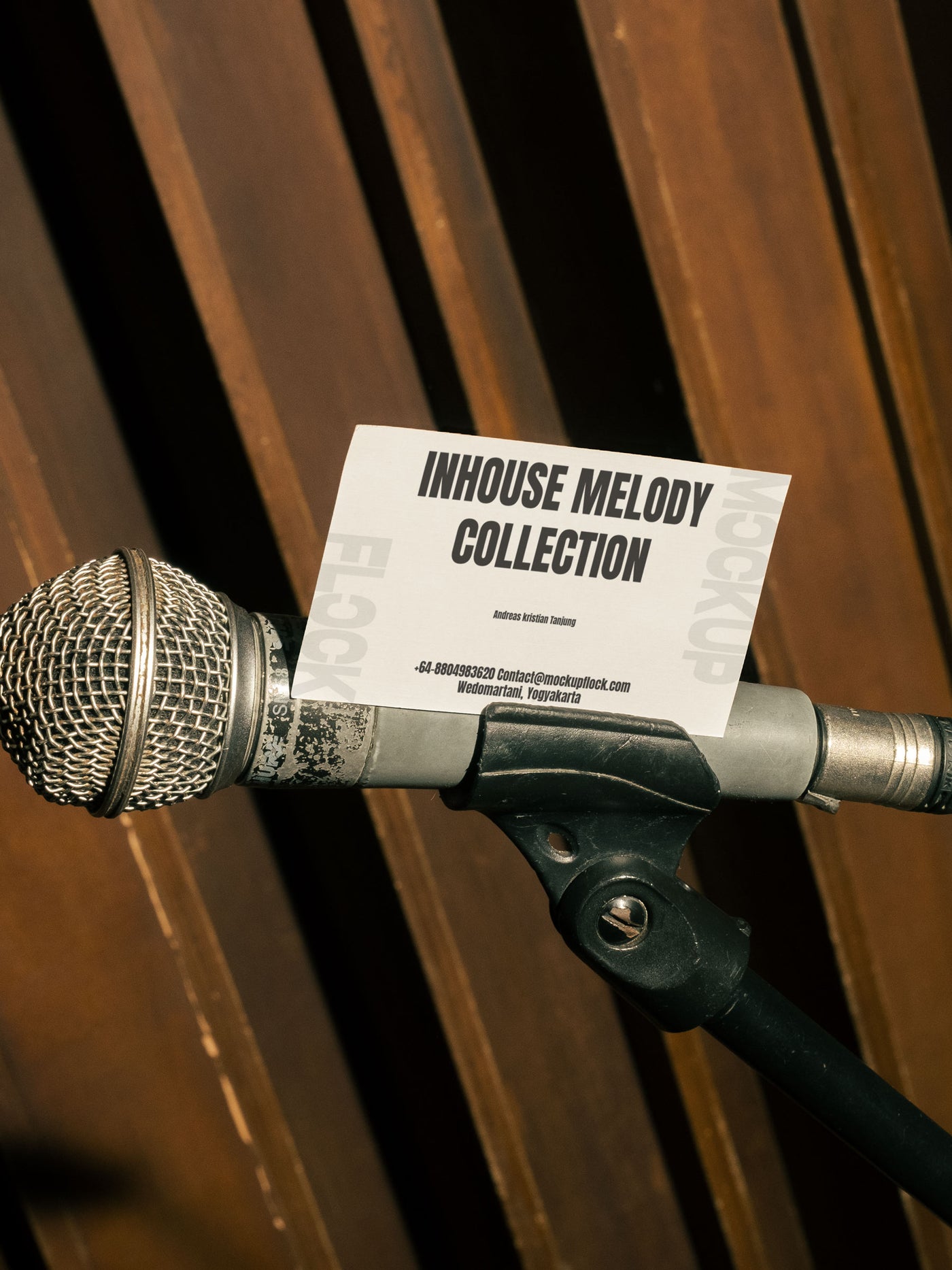 High quality business card mockup leaning on a mic hardware. Aesthetic print mockup created for Adobe Photoshop