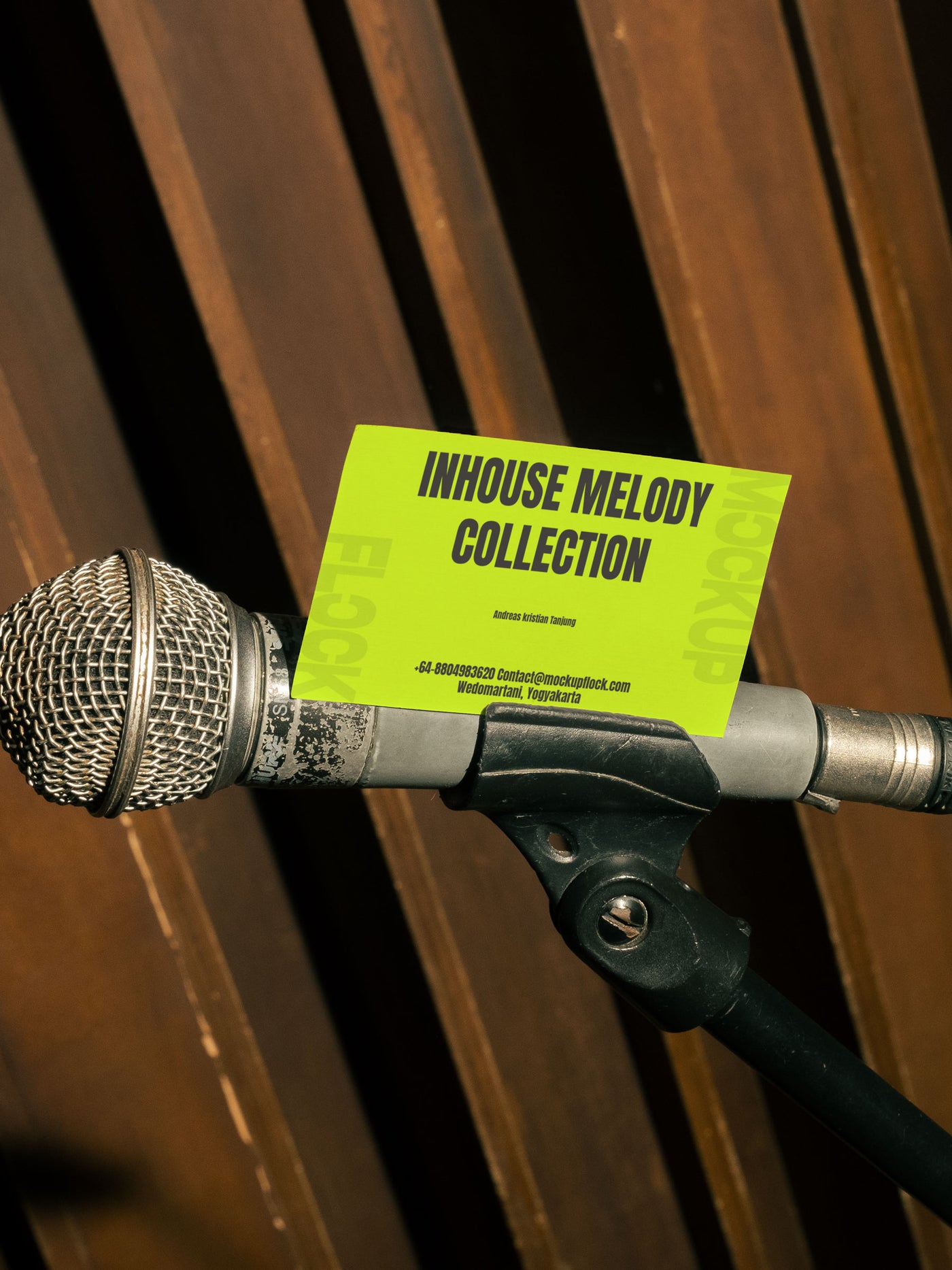 High quality business card mockup leaning on a mic hardware. Aesthetic print mockup created for Adobe Photoshop