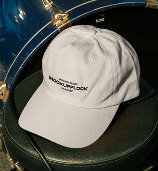 High quality hat mockup leaning on a drum throne. Aesthetic print mockup created for Adobe Photoshop