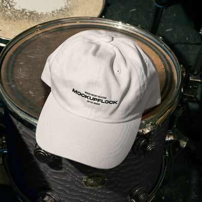 High quality hat mockup leaning on a floor tom. Aesthetic print mockup created for Adobe Photoshop