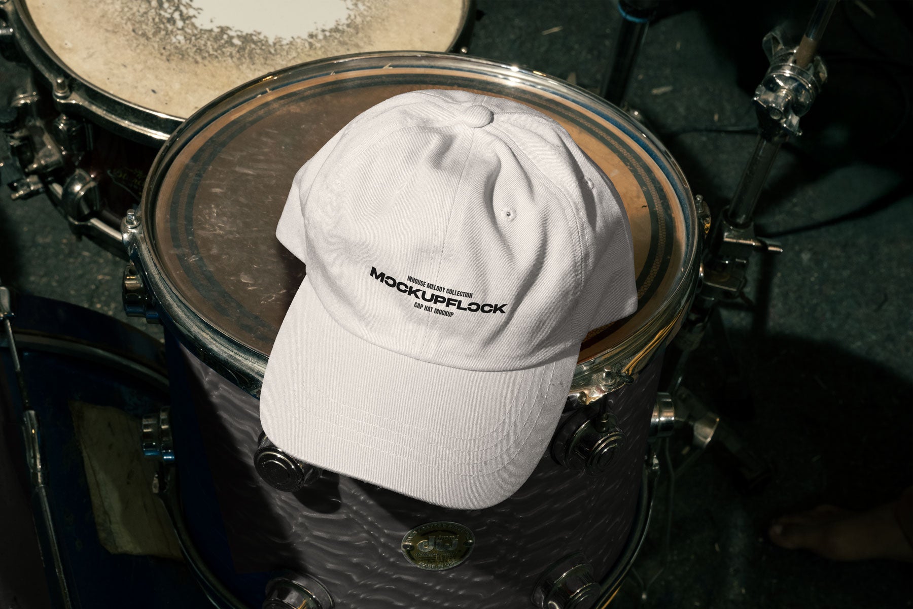 High quality hat mockup leaning on a floor tom. Aesthetic print mockup created for Adobe Photoshop