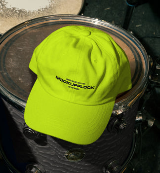 High quality hat mockup leaning on a floor tom. Aesthetic print mockup created for Adobe Photoshop