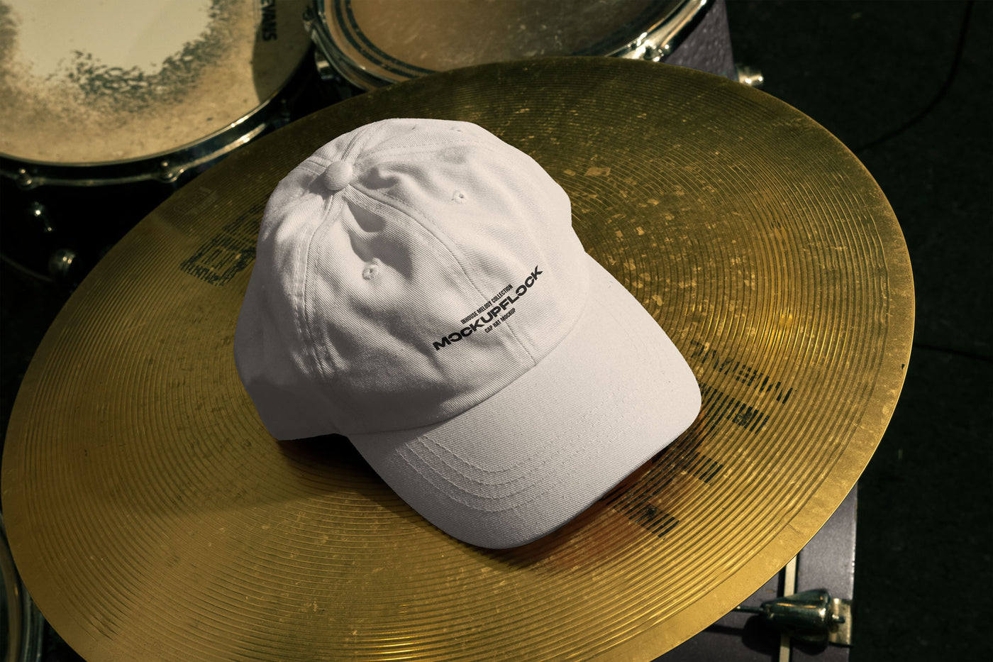 High quality cap hat mockup leaning on a cymbal drums. Aesthetic print mockup created for Adobe Photoshop