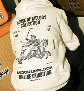 This high quality poster mockup features a person sitting in a poster frame in a music studio. This aesthetic print mockup was created for Adobe Photoshop.