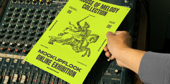 A high quality poster mockup featuring a person holding a poster over an analog mixer. An aesthetic print mockup created for Adobe Photoshop.
