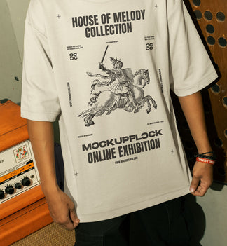 This high-quality t-shirt mockup features a person standing in front of an orange amplifier in a music studio. This aesthetic print mockup was created in Adobe Photoshop.