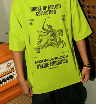 This high-quality t-shirt mockup features a person standing in front of an orange amplifier in a music studio. This aesthetic print mockup was created in Adobe Photoshop.