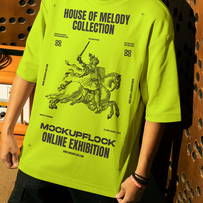 This high-quality t-shirt mockup features a person standing in front of an orange amplifier in a music studio. This aesthetic print mockup was created in Adobe Photoshop.