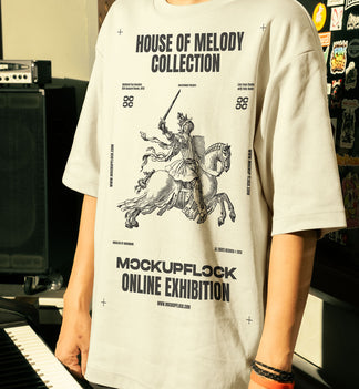 This high-quality t-shirt mockup features a person standing in front of an orange amplifier in a music studio. This aesthetic print mockup was created in Adobe Photoshop.
