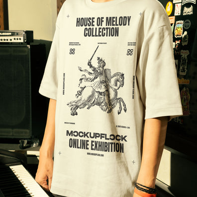 This high-quality t-shirt mockup features a person standing in front of an orange amplifier in a music studio. This aesthetic print mockup was created in Adobe Photoshop.