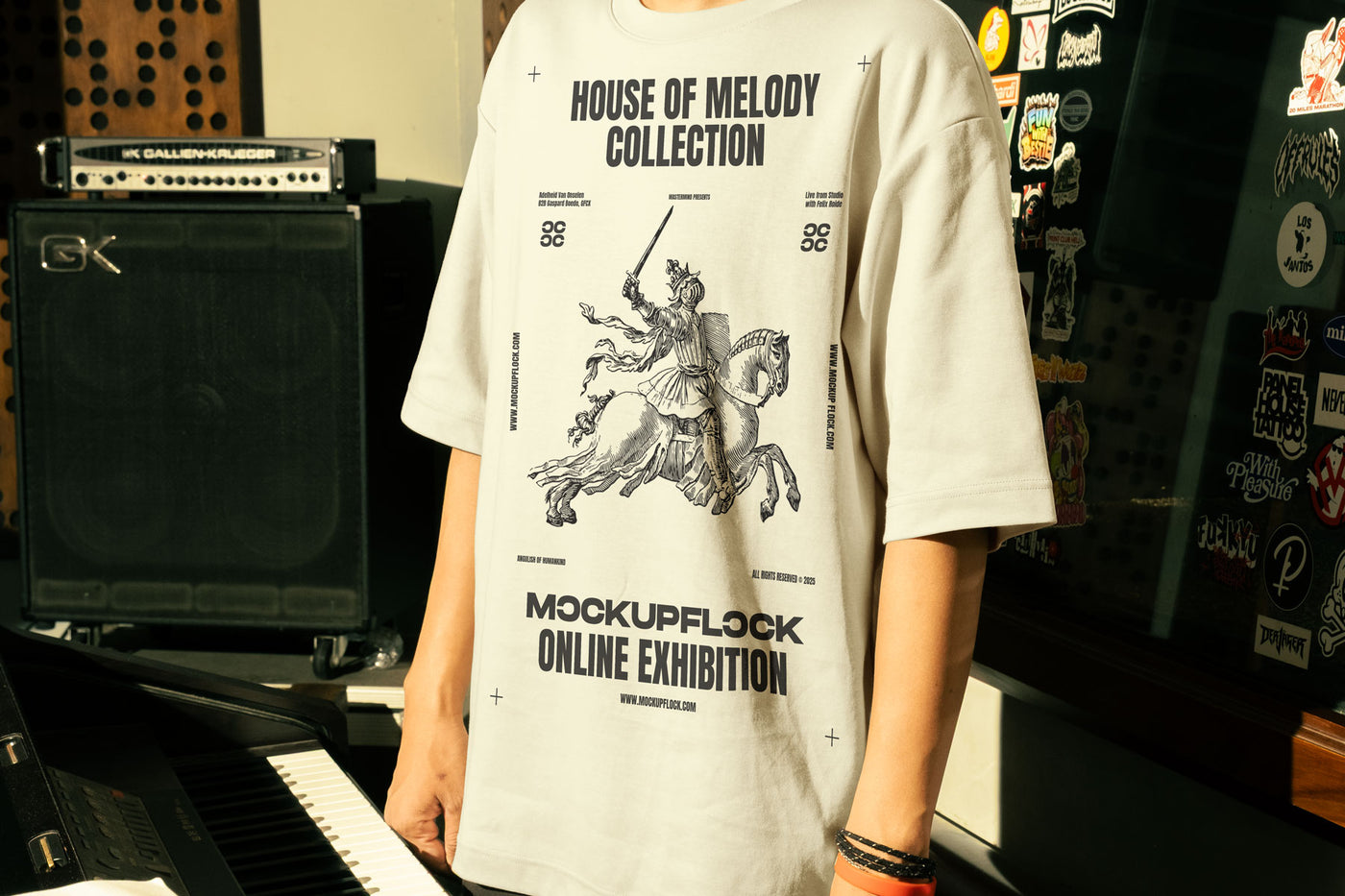 This high-quality t-shirt mockup features a person standing in front of an orange amplifier in a music studio. This aesthetic print mockup was created in Adobe Photoshop.