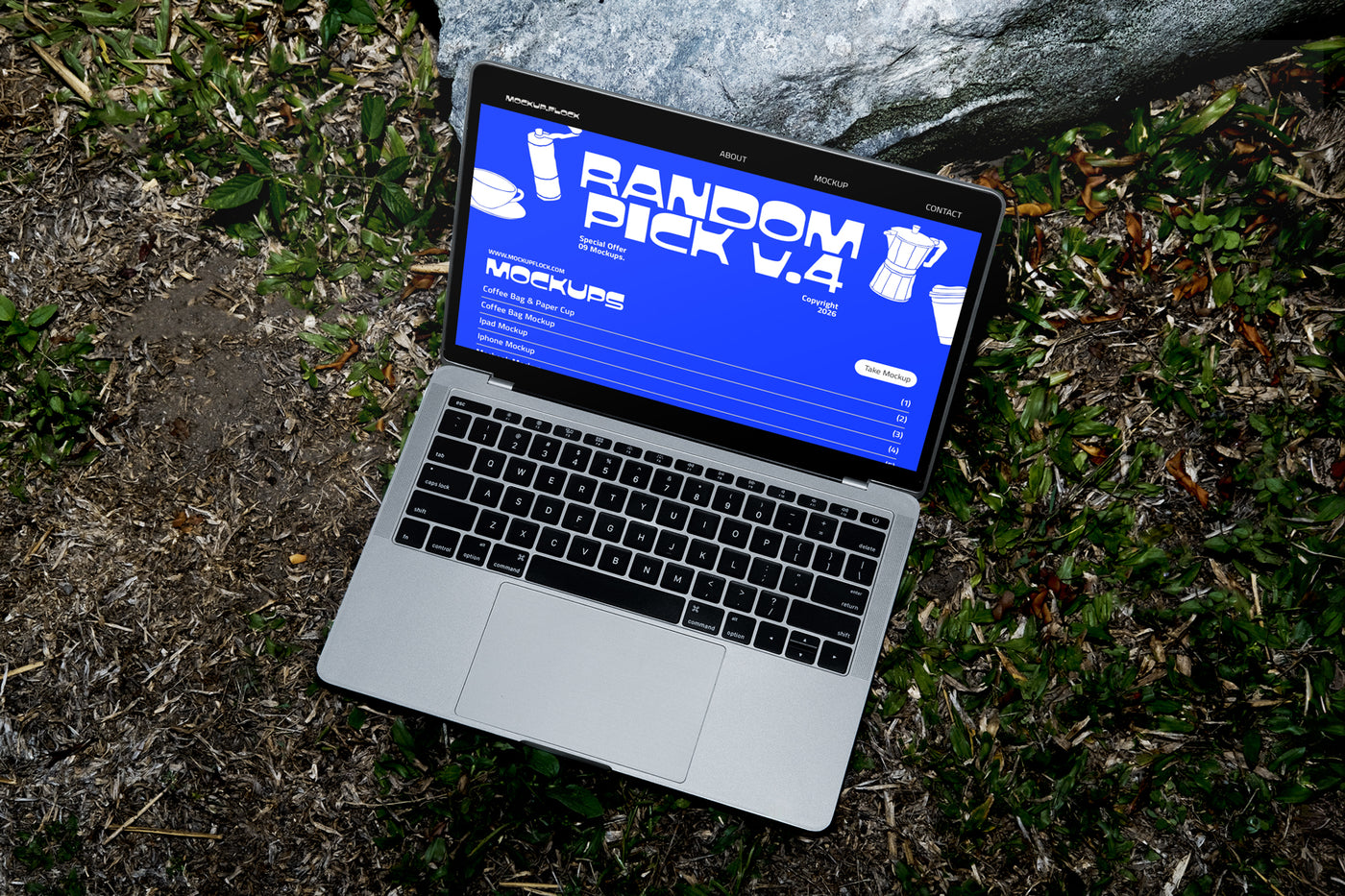 Laptop on grass displaying chunky font typeface, ideal for designer looking mockups, graphic design, typography inspiration, and digital assets.