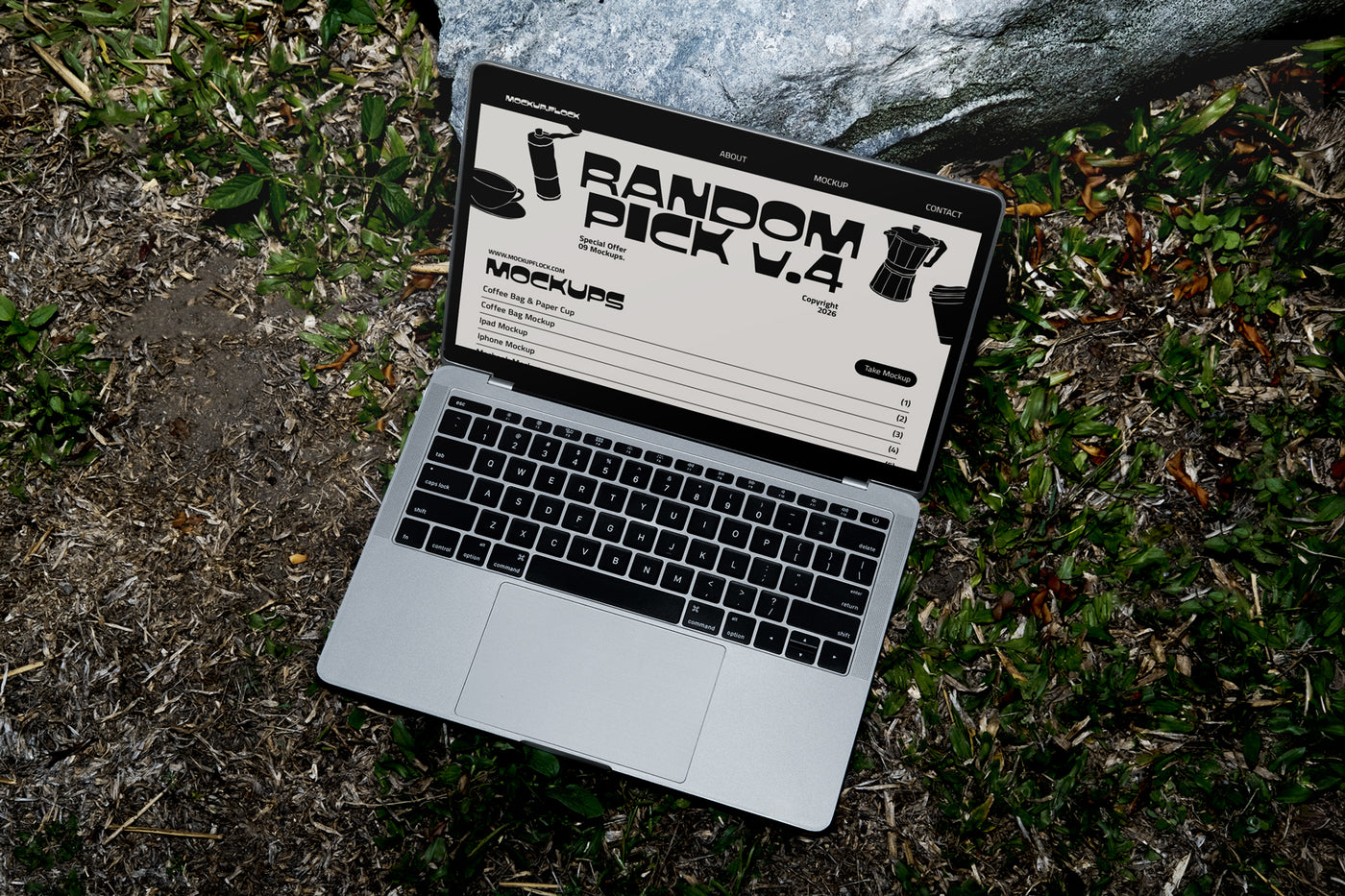 Laptop on grass displaying chunky font typeface, ideal for designer looking mockups, graphic design, typography inspiration, and digital assets.