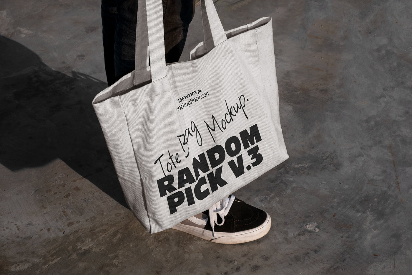 urban tote bag mockup lying on top of black shoes