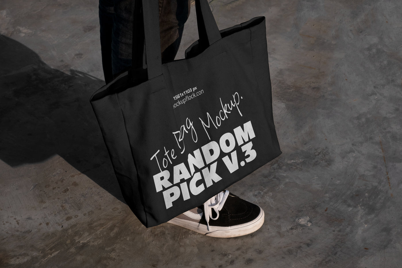 urban tote bag mockup lying on top of black shoes