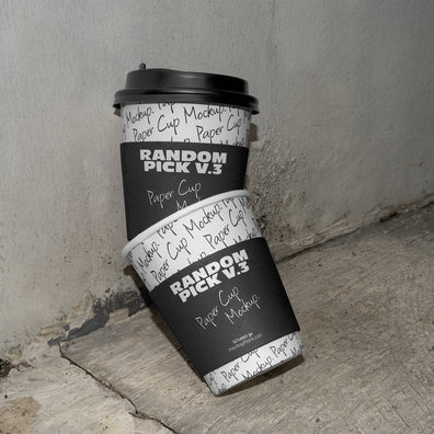 stacked urban paper cups mockup with text design on a realistic concrete floor against a gray wall