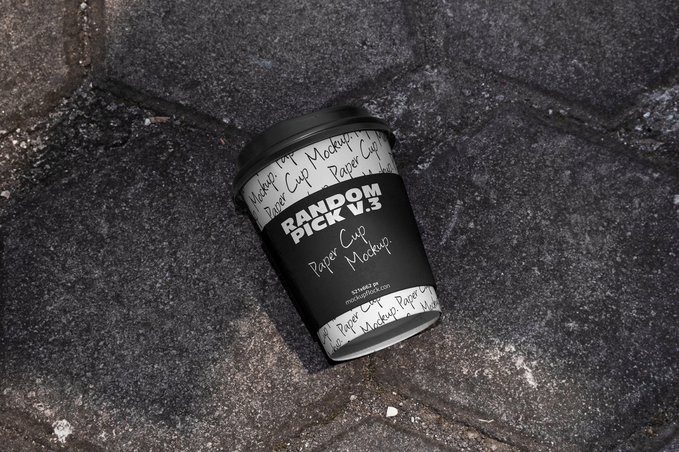 industrial paper cup mockup with a label on a realistic stone surface