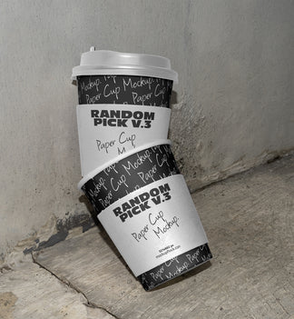 stacked urban paper cups mockup with text design on a realistic concrete floor against a gray wall