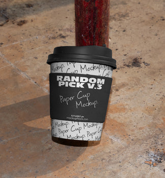 urban paper cup leaning on the leg of the chair mockup by mockup flock