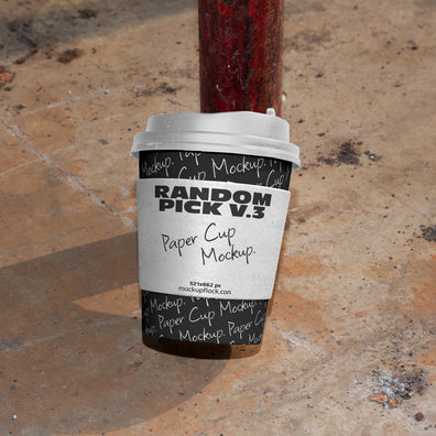 urban paper cup leaning on the leg of the chair mockup by mockup flock