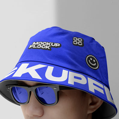 A person wearing a bucket hat and blue glasses, written MOCKUP FLOCK