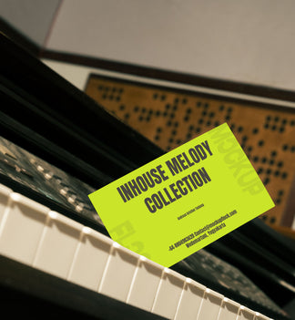 business card mockup leaning on a piano