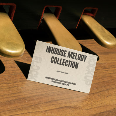business card mockup leaning on a pedal piano