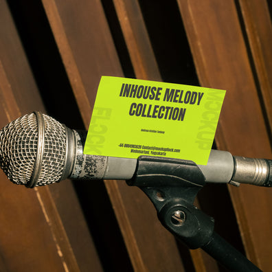 business card mockup leaning on a vocal microphone