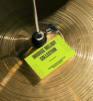 business card mockup leaning on a cymbal drums