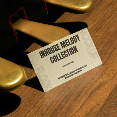 business card mockup leaning on a pedal piano